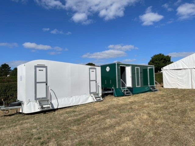 Both luxury portable toilets next to each other