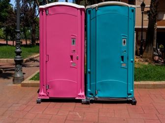 Blue and pink portable toilets