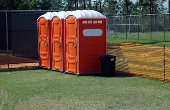 Orange portable toilets