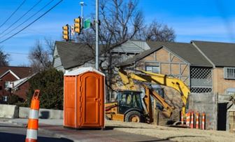 Orange portable toilet