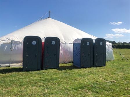 Toilets in a field