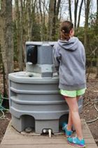 hand wash station with girl using the hand wash station at an outdoor event