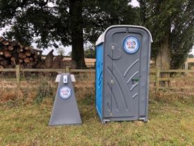 hand washing station stand next to portable toilet in Northampton